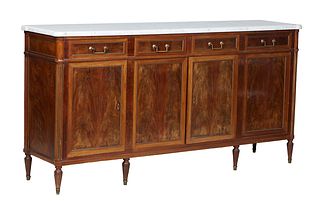 French Louis XVI Style Carved Walnut Marble Top Sideboard, 20th c., the cookie corner ogee edge figured white marble, over four frieze drawers and fou
