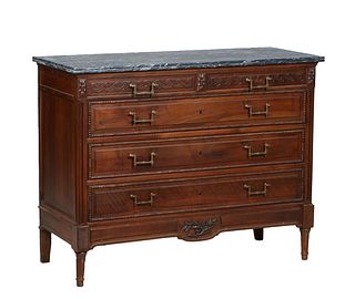 French Carved Walnut Louis XVI Style Marble Top Commode, late 19th c., the reeded edge highly figured gray marble over two setback frieze drawers abov