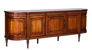 French Carved Cherry Louis XVI Style Sideboard, 20th c., the ogee edge cookie corner bowed top over three setback fielded panel cupboard doors flanked