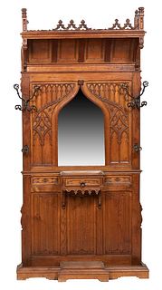 Exceptional Medieval Style Gothic Carved Oak and Iron Hall Stand, late 19th c., with relief gothic arch carving flanking a wide beveled gothic arch mi
