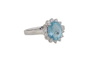 Lady's 14K White Gold Dinner Ring, with an oval 1.86 carat aquamarine, atop a border of round diamonds, total diamond wt.- .35 cts., Size 7 1/4, with 