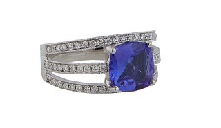 Lady's 18K White Gold Dinner Ring, with a cushion cut 2.26 ct, tanzanite atop a triple split diamond mounted band, total diamond wt.- .47 cts., Size 6