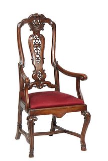 English Carved Mahogany Armchair, 19th c., the canted arched back with a pierced vertical splat, to scrolled arms and a slip seat, on cabriole legs wi