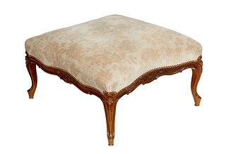 Large French Louis XV Style Footstool, 20th c., the curved cushioned top over floral carved skirts, on cabriole legs with toupie feet, in pale grey ve