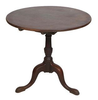 English Queen Anne Style Carved Walnut Tilt Top Tea Table, 19th c., the circular top over a birdcage support on a baluster turned pedestal on tripodal