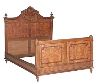 French Louis XVI Carved Burled Walnut Double Bed, early 20th c., the arched floral carved headboard joined by wooden rails and a fielded panel footboa