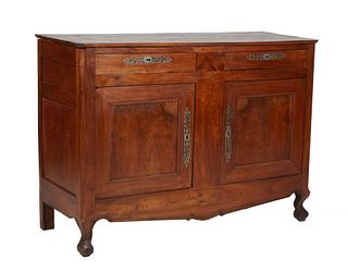 French Provincial Louis XV Style Carved Walnut Sideboard, 19th c., the rounded edge and corner three board top over three frieze drawers above double 