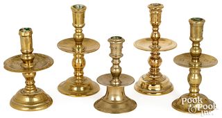 Five brass candlesticks, 17th/18th c.