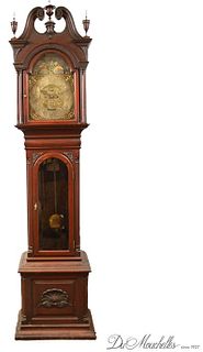 CARVED MAHOGANY GRANDFATHER CLOCK, RETAILED BY WILLIAM GIBBONS, PHILADELPHIA, C.1900-1904 H 95" W 24" D 16.5" 