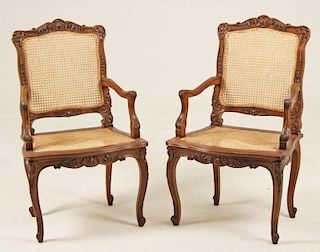 PAIR OF LOUIS XV STYLE CARVED WALNUT FAUTEUILS