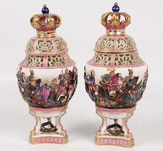 PAIR OF CONTINENTAL PORCELAIN CAPPED URNS