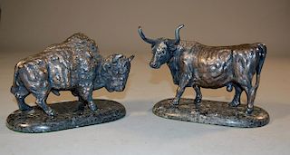 Two sterling figures of a bison and a steer, mounted on granite bases