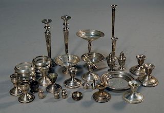 Lot of weighted sterling silver candlesticks, salts, compotes. 34 pieces total