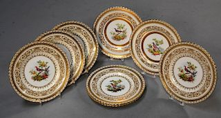 Eight Minton 10 5/8" service plates with painted bird centers and ornate gilt boarders