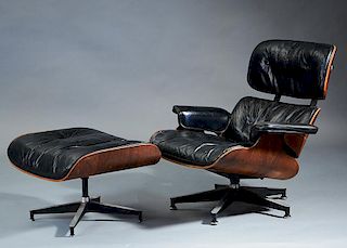 Herman Miller black leather and rosewood chair and ottoman