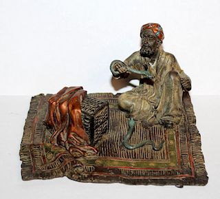 Cold painted bronze snake charmer