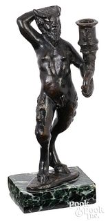 Bronze candlestick in the form of a standing satyr