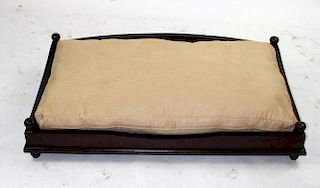 Mahogany dog bed with upholstered cushion