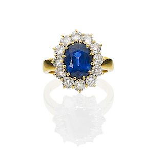 BLUE SAPPHIRE & DIAMOND OVAL CLUSTER GOLD RING