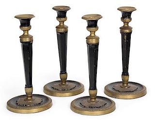 Four Neoclassical Style Black and Gilt Decorated Metal Candlesticks Height 10 1/2 inches.