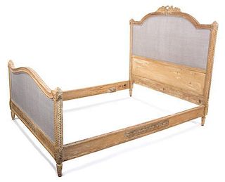A Louis XVI Style Carved Wood Full-Size Bed Height 58 1/2 x width 57 1/2 x depth 75 inches.