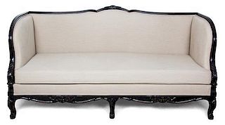 A French Empire Style Upholstered Mahogany Settee Height 30 x width 74 1/2 x depth 30 inches.