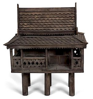 A Balinese Carved Wood Birdhouse Height 24 x width 19 x depth 13 1/2 inches.