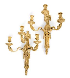 A Pair of Louis XVI Style Gilt Bronze Three-Light Wall Sconces Height 19 1/2 inches.