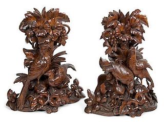 A Pair of Continental Carved Wood Sculptures Height 15 x width 12 inches.