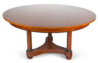 A Biedermeier Style Walnut Dining Table Height 29 x diameter 54 inches; each leaf 54 x 12 inches.