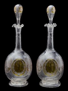 A Pair of Etched and Amber Overlay Glass Decanters Height 11 3/4 inches.