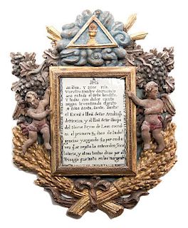 A Spanish Carved and Parcel Retablo Height 26 x width 21 inches.
