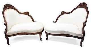 A Pair of Rococo Revival Laminated Rosewood Love Seats Height 38 1/2 x width 40 inches.