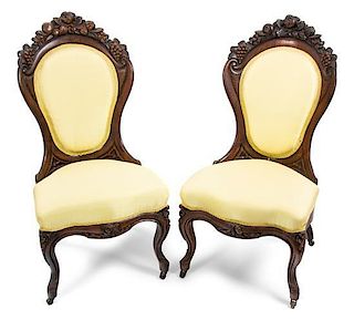 A Pair of Rococo Revival Laminated Rosewood Parlor Chairs Height 36 1/2 inches.
