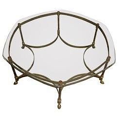 An Octagonal Brass and Glass Top Cocktail Table Height 15 1/2 x width 40 x depth 40 inches.