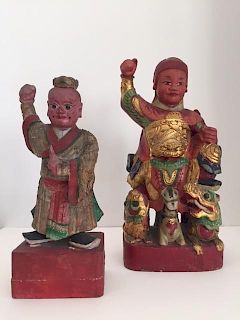 Two Chinese Parcel-Gilt and Polychrome-Decorated Figures Height of tallest 12 inches.