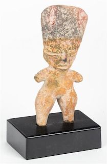A Mexican Solid Standing Female Figure Height 5 1/4 inches.