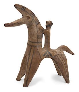 A Pre-Colombian Style Pottery Figure Height 10 inches.