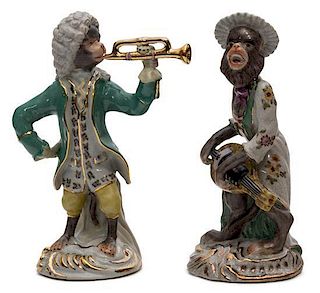 A Pair of Polychrome and Gilt Decorated Porcelain Figures Height of taller 10 inches.