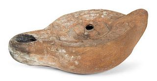 A Roman Style Pottery Oil Lamp Length 4 3/4 inches.
