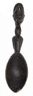 An African Carved Figural Scoop Length 23 inches.