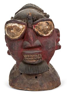 An African Carved and Polychrome Decorated Headdress Height 12 1/2 inches.