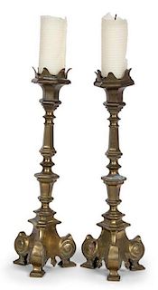 A Pair of Brass Candlesticks Height 15 inches.