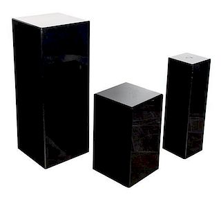A Group of Three Contemporary Black Lacquered Pedestals Height of largest 36 inches.