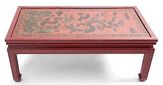 A Chinese Red Lacquer Low Table Height 16 1/2 x width 42 x depth 20 1/2 inches.