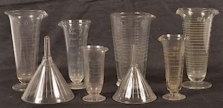 Eight Pharmacist Glass Beakers and Funnels.