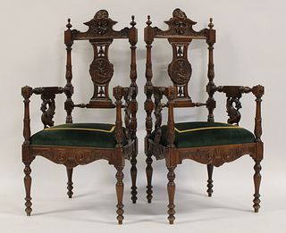 A Pair of Carved Victorian Arm Chairs.