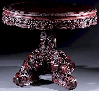 A CHINESE EXPORT CARVED MAHOGANY PARLOR TABLE