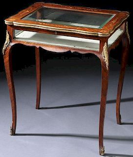 A LOUIS XVI STYLE GILT BRONZE AND MARQUETRY TABLE