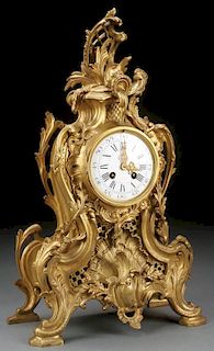 A FRENCH ROCOCO BRONZE MANTLE CLOCK